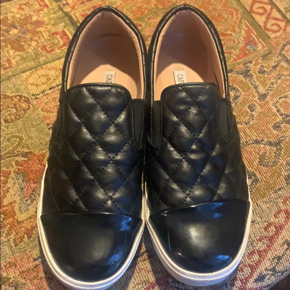Black quilted slip on tennis shoes